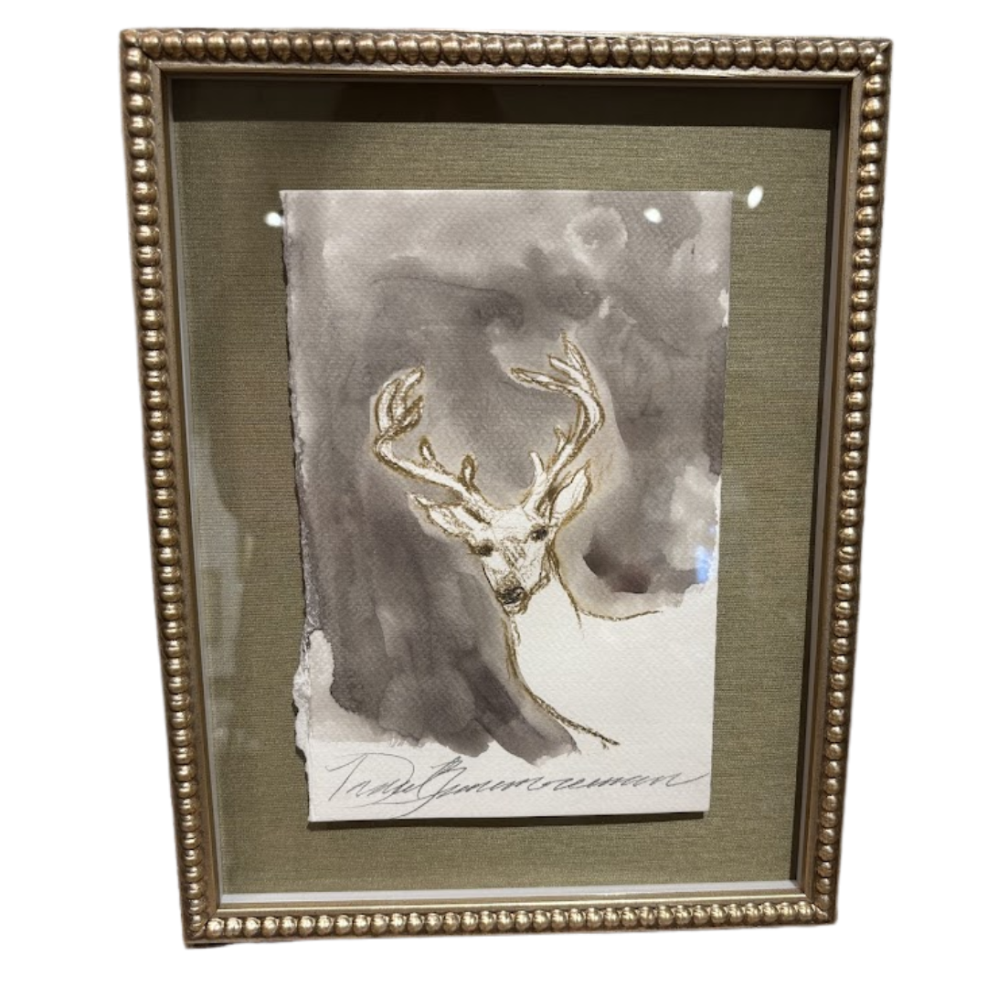 Framed artwork of a deer head with gold antlers on a textured background