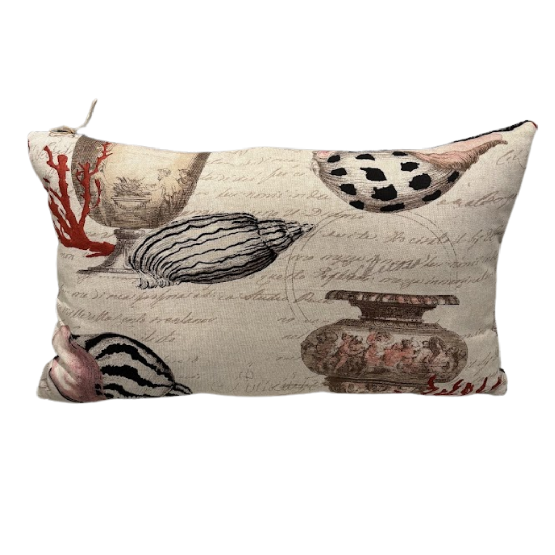 Decorative pillow with shell and coral design on a beige background