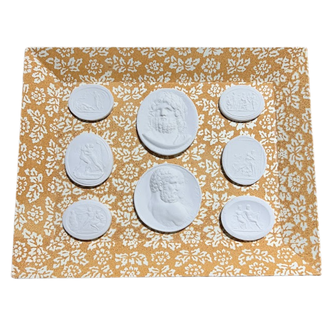 White circular objects on a yellow floral-patterned mat