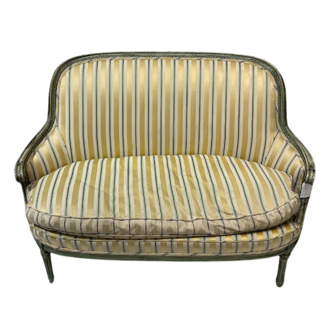 Striped sofa with a green and yellow pattern on a white background