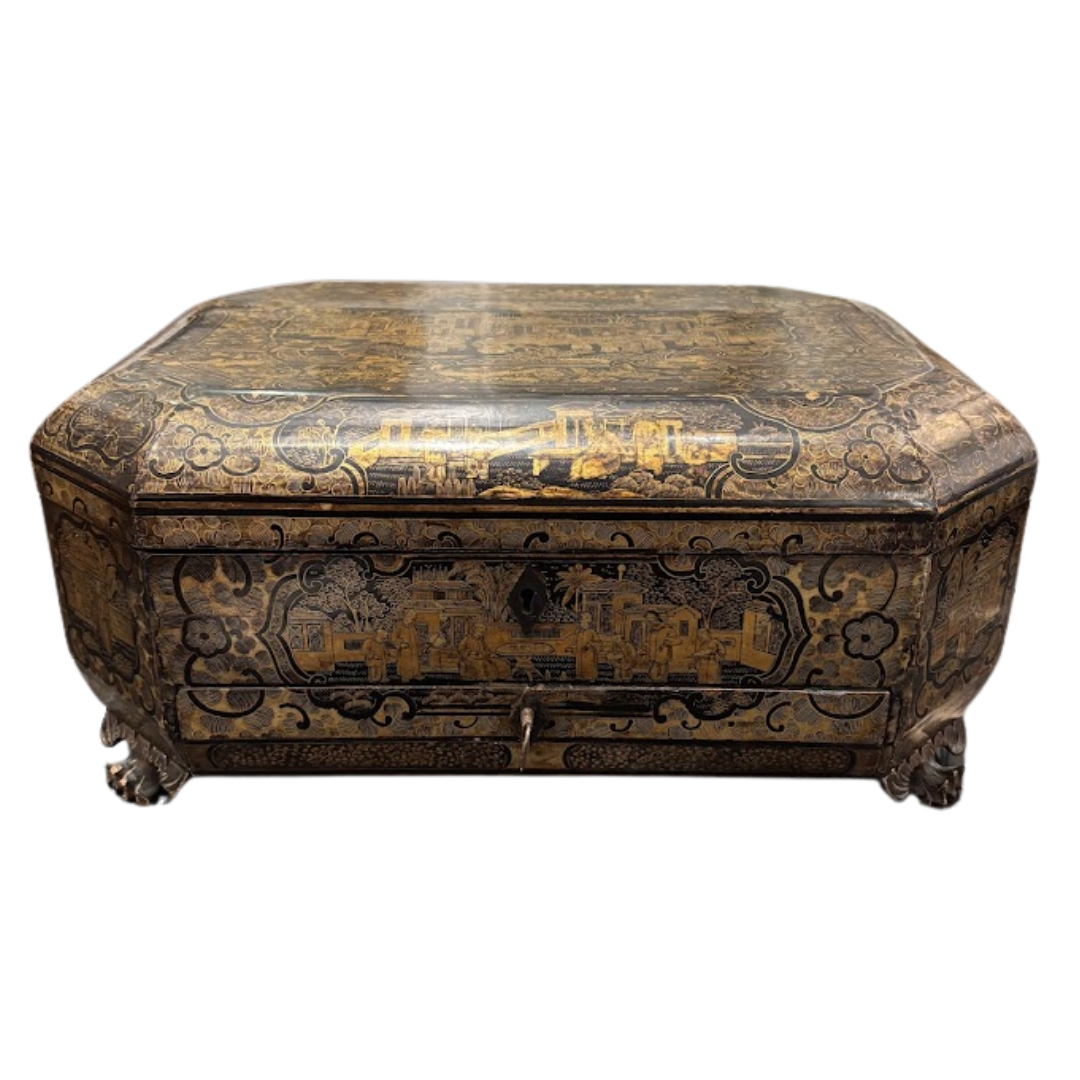 Decorative wooden box with intricate carvings on a white background