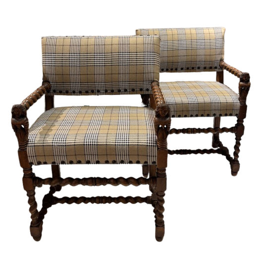 Pair of wooden chairs with plaid fabric on a white background