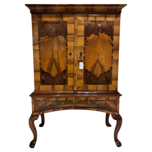 Wooden cabinet with intricate design on a white background