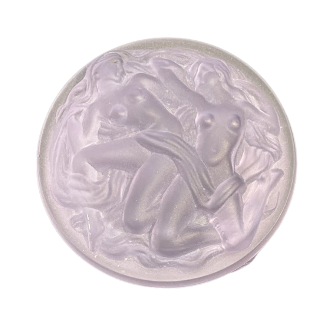 Decorative glass piece with artistic design on a white background