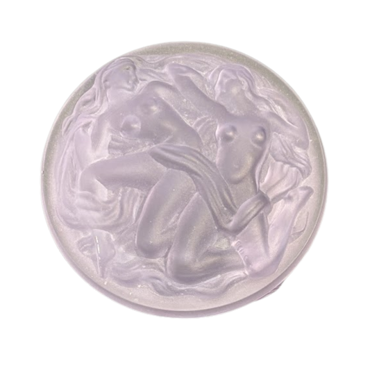 Decorative glass piece with artistic design on a white background