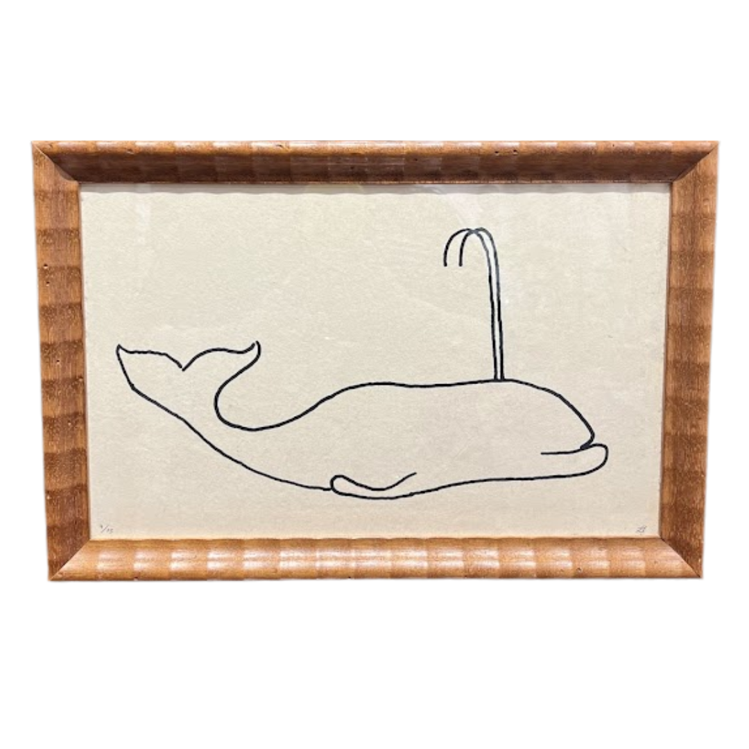 Framed artwork of a whale and hook on a white background