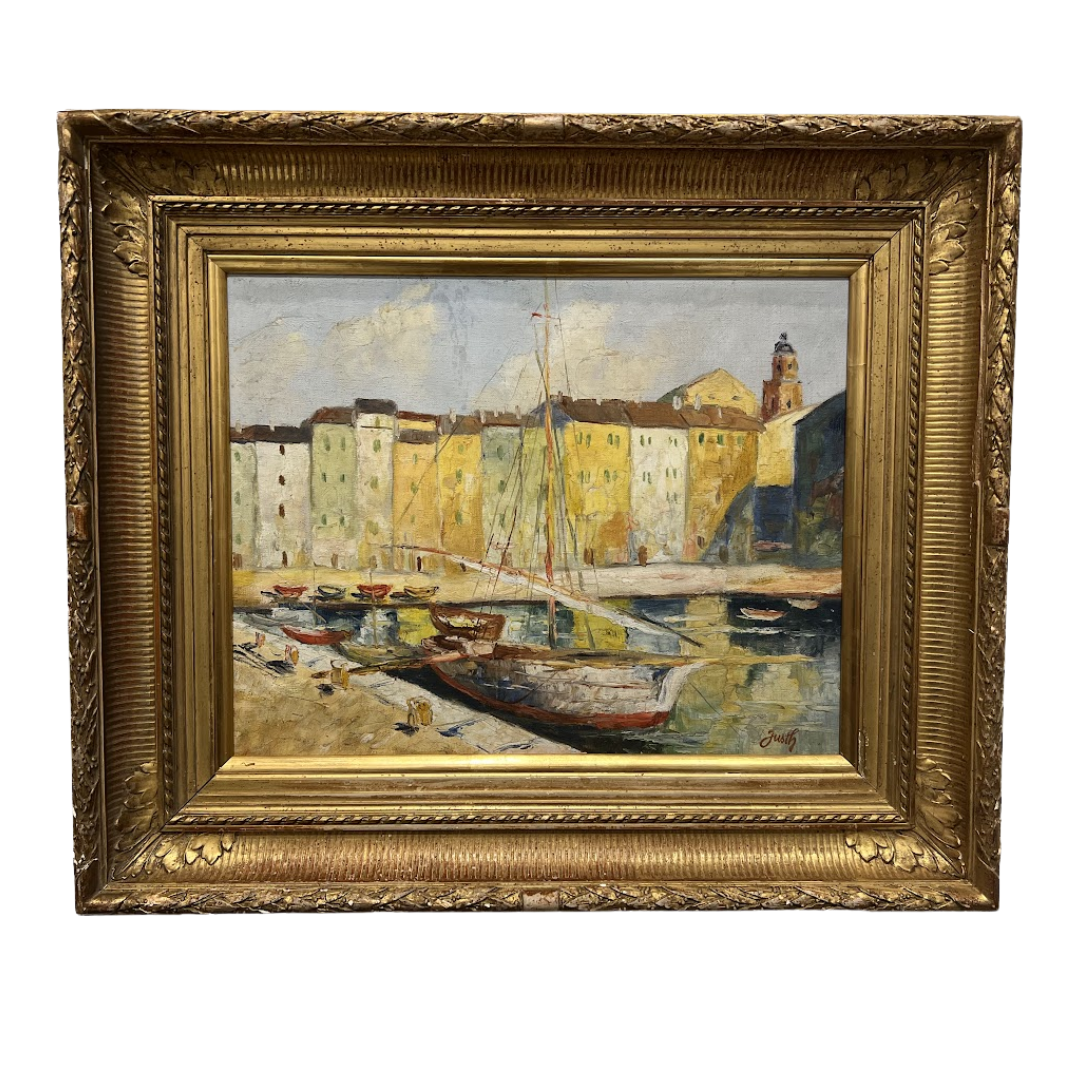 Painting of a harbor scene with boats and buildings in a gold frame.