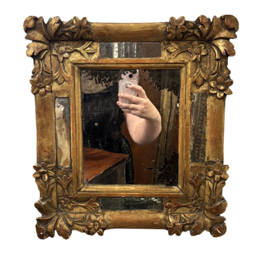 carved gilt mirror on white background
