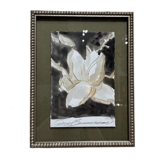 Framed artwork of a white flower with a dark background, signed by David Bromley.