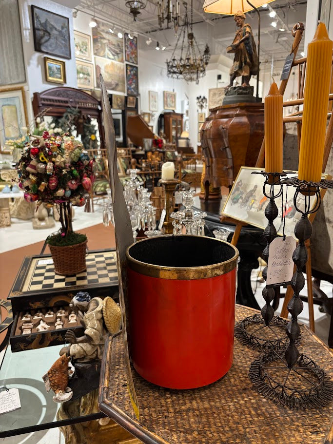 Vintage store interior with various antiques and decor items on tables.