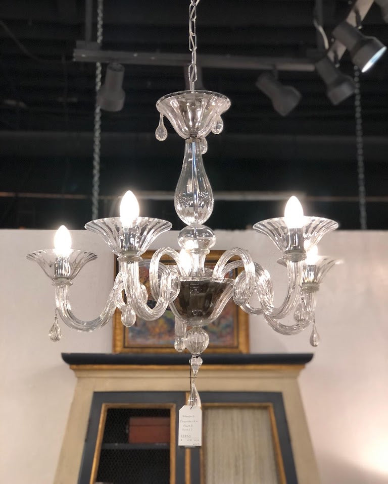 Antique chandelier and vintage wall sconces displayed at Interiors Market Atlanta