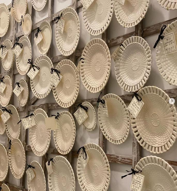 Decorative antique platters and vintage dishes styled for display at Interiors Market Atlanta