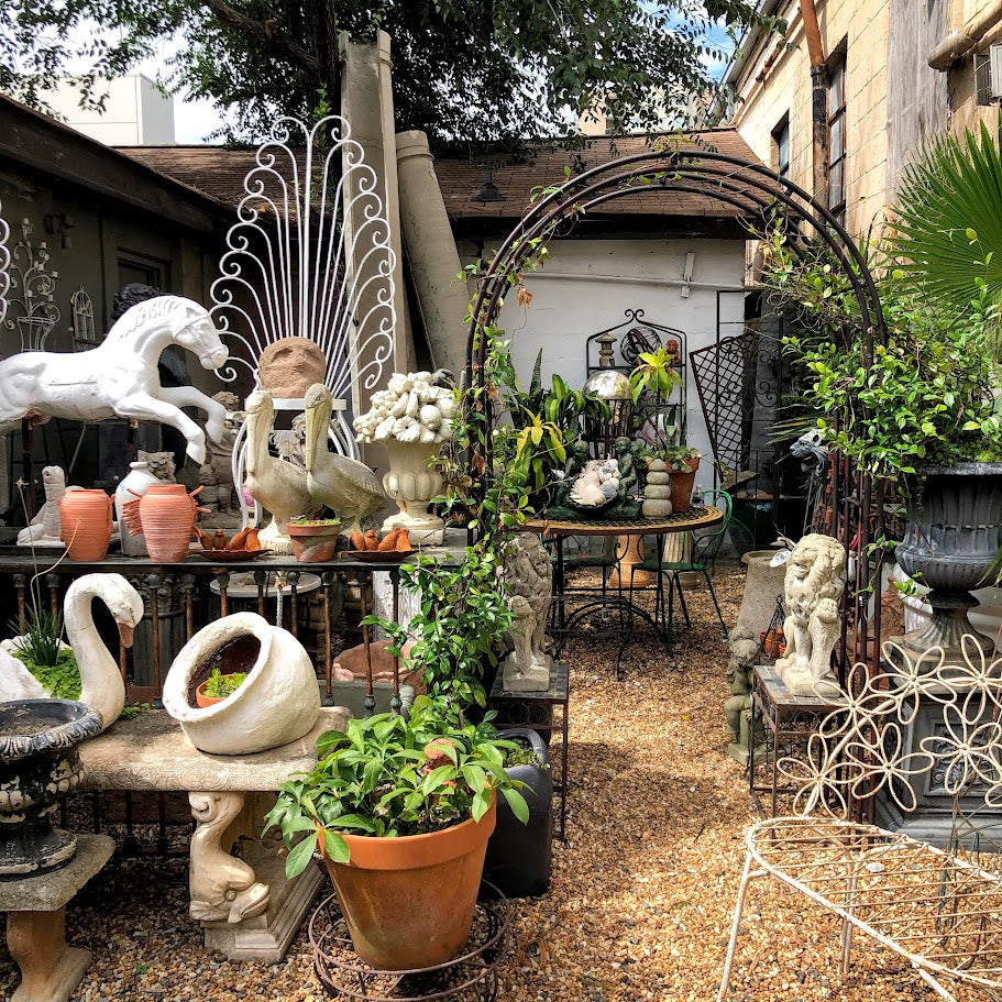 Antique garden urns and vintage planters displayed at Interiors Market Atlanta