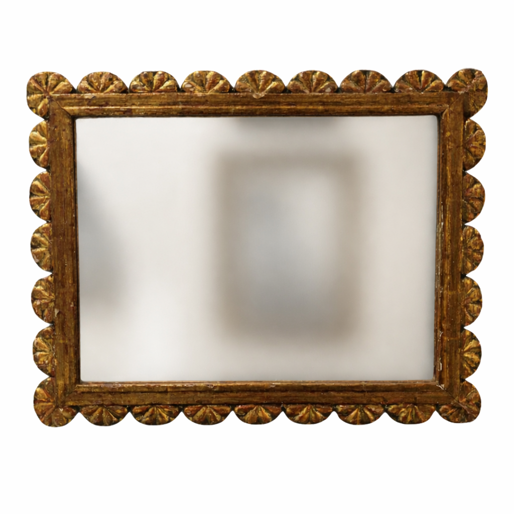 Decorative mirror with a gold frame on a white background