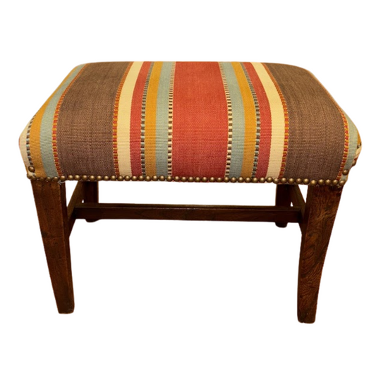Striped stool with wooden legs on a white background