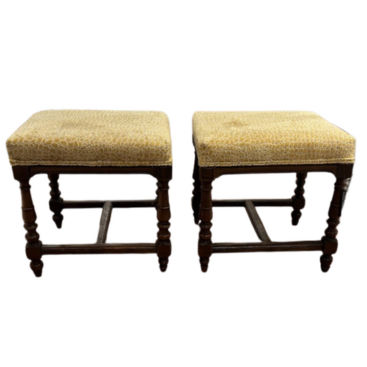 Pair of vintage stools with woven seats on a white background