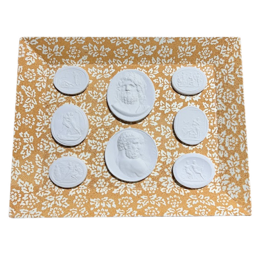 White circular objects on a yellow floral-patterned mat