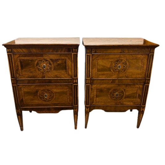 Pair of wooden nightstands with decorative inlays on a white background