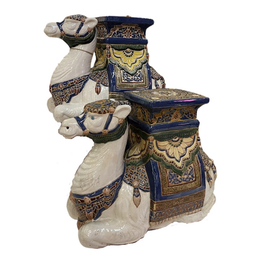 Decorative ceramic stools of camels and intricate patterns on a white background