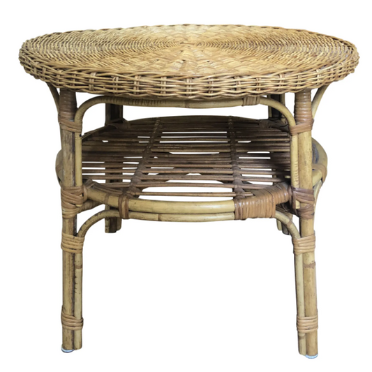 Round wicker table on a white background