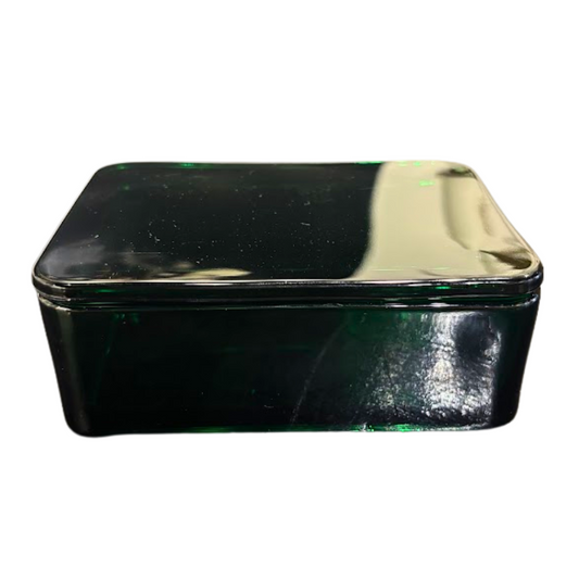 Black rectangular tin box with a reflective surface on a white background