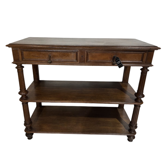 Wooden console table with two drawers and a shelf on a white background