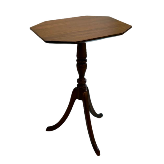 Wooden side table with a hexagonal top on a white background