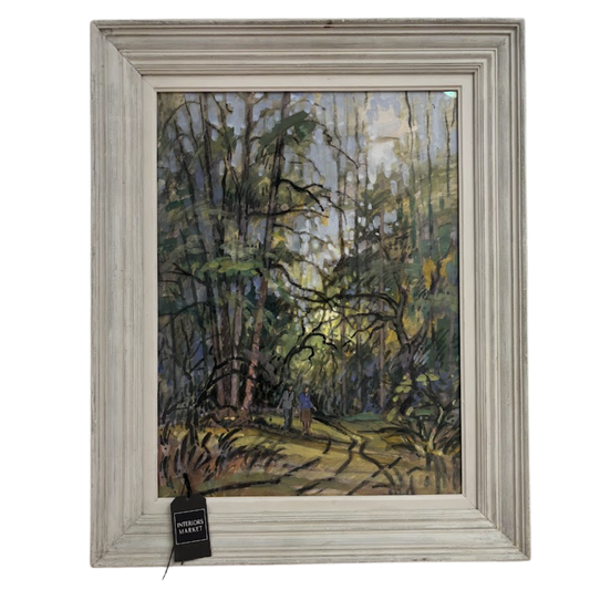 Framed painting of a forest scene with a person walking through it.