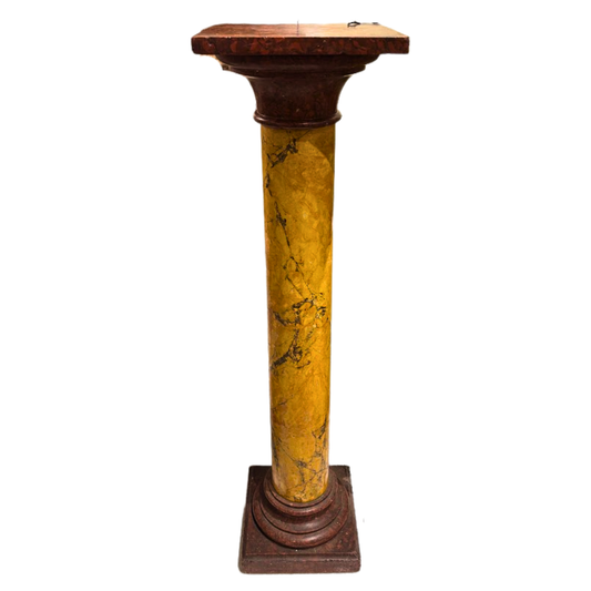 Decorative column with a marble-like yellow and brown design on a white background