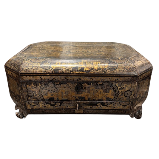 Decorative wooden box with intricate carvings on a white background