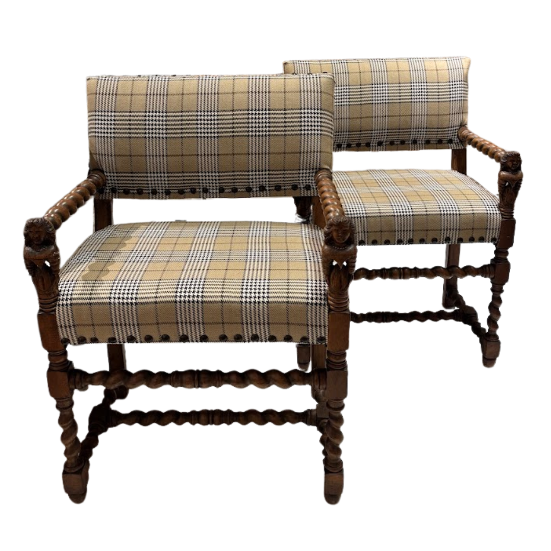 Pair of wooden chairs with plaid fabric on a white background