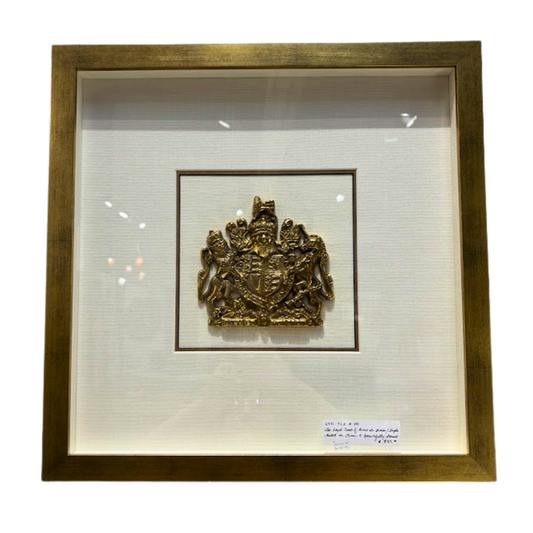 Framed gold emblem on a white background