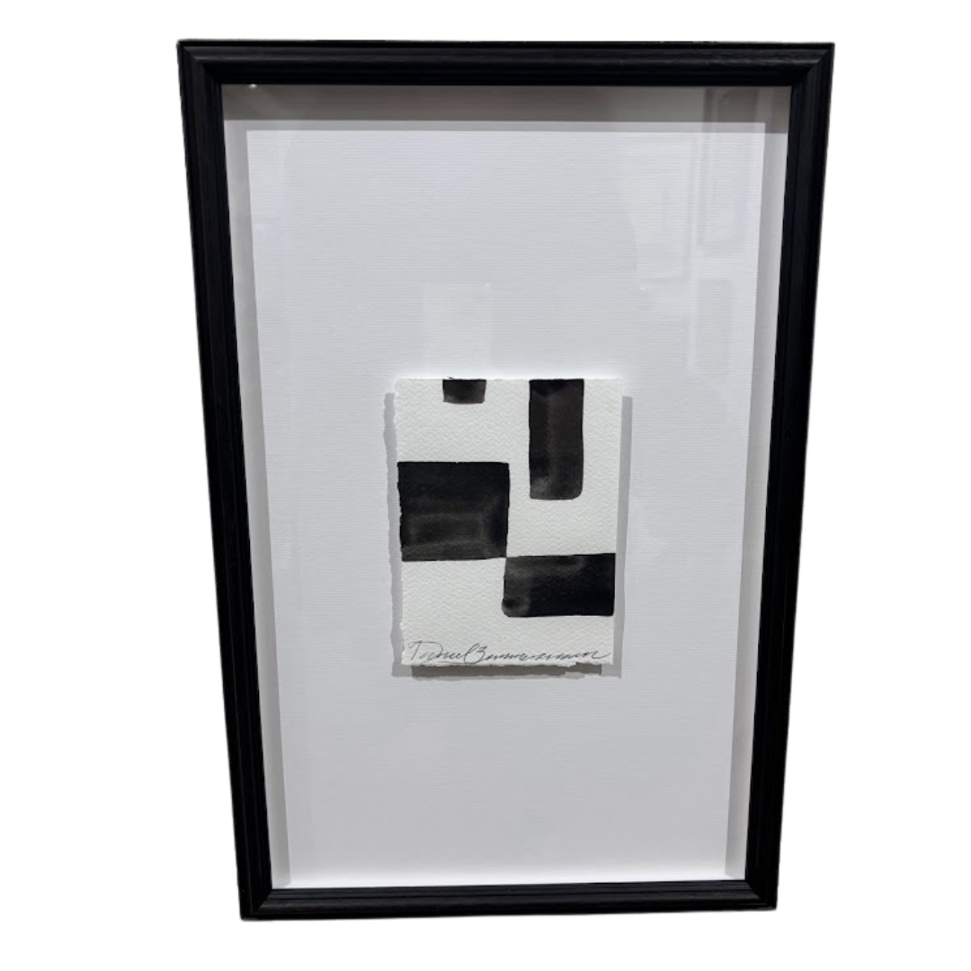 Framed black and white abstract artwork on a white background