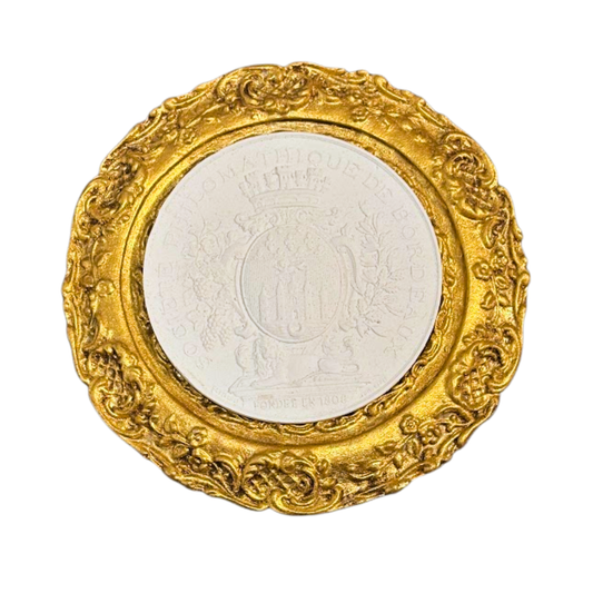 Decorative gold frame with a white center on a white background