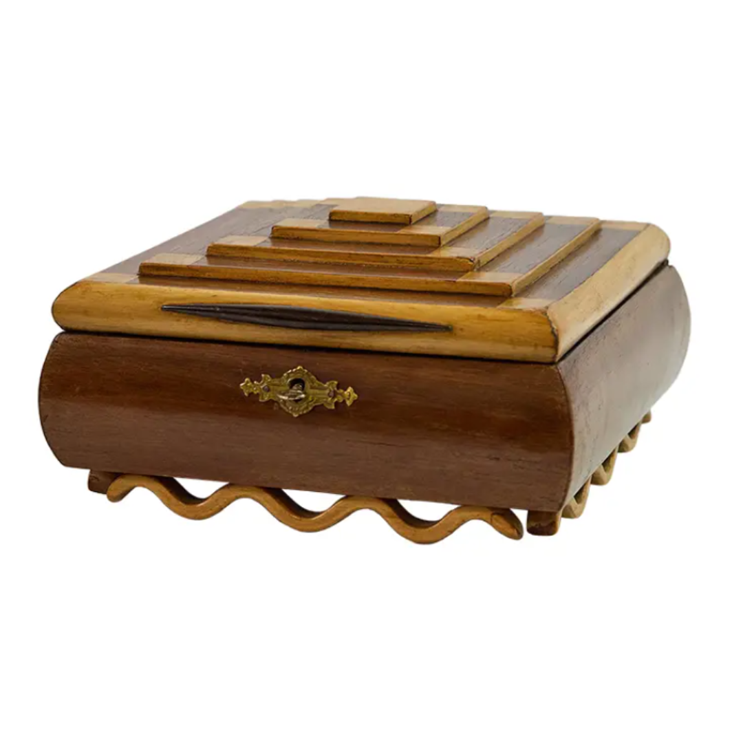 Wooden jewelry box with a decorative clasp on a white background