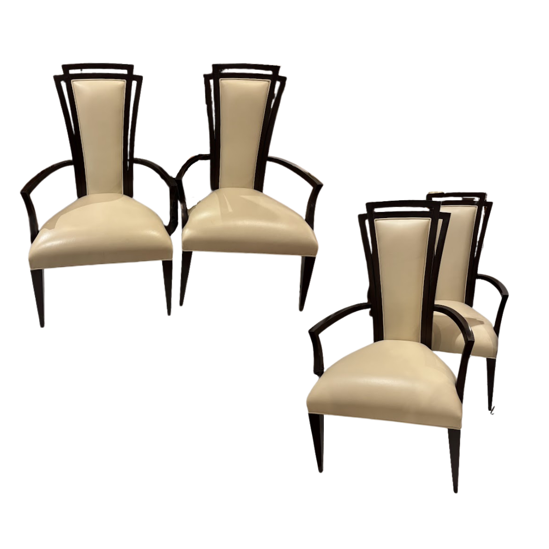Set of four beige chairs with black frames on a white background