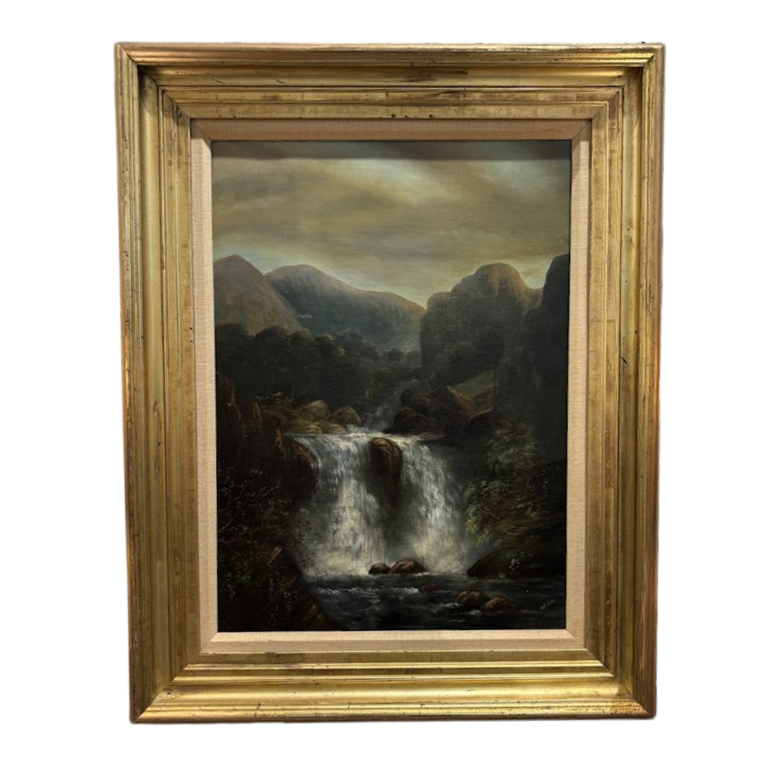 Framed painting of a mountain landscape with a waterfall
