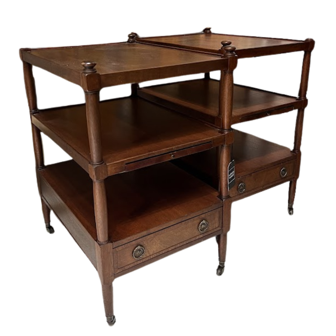 Wooden side table with multiple shelves and a drawer on a white background