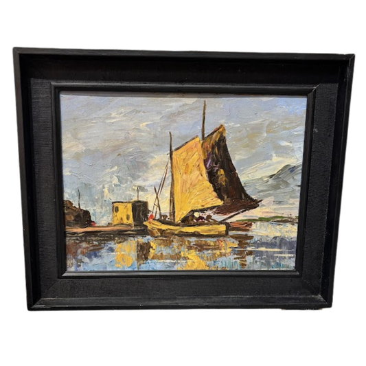 Framed painting of a sailboat on water with a black frame