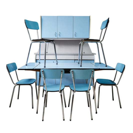 Blue dining table set with chairs against a white background