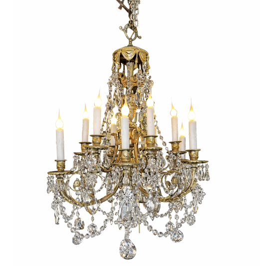 Decorative chandelier with crystal elements and candles on a white background