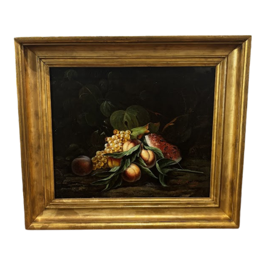 Framed still life painting of fruits on a dark background