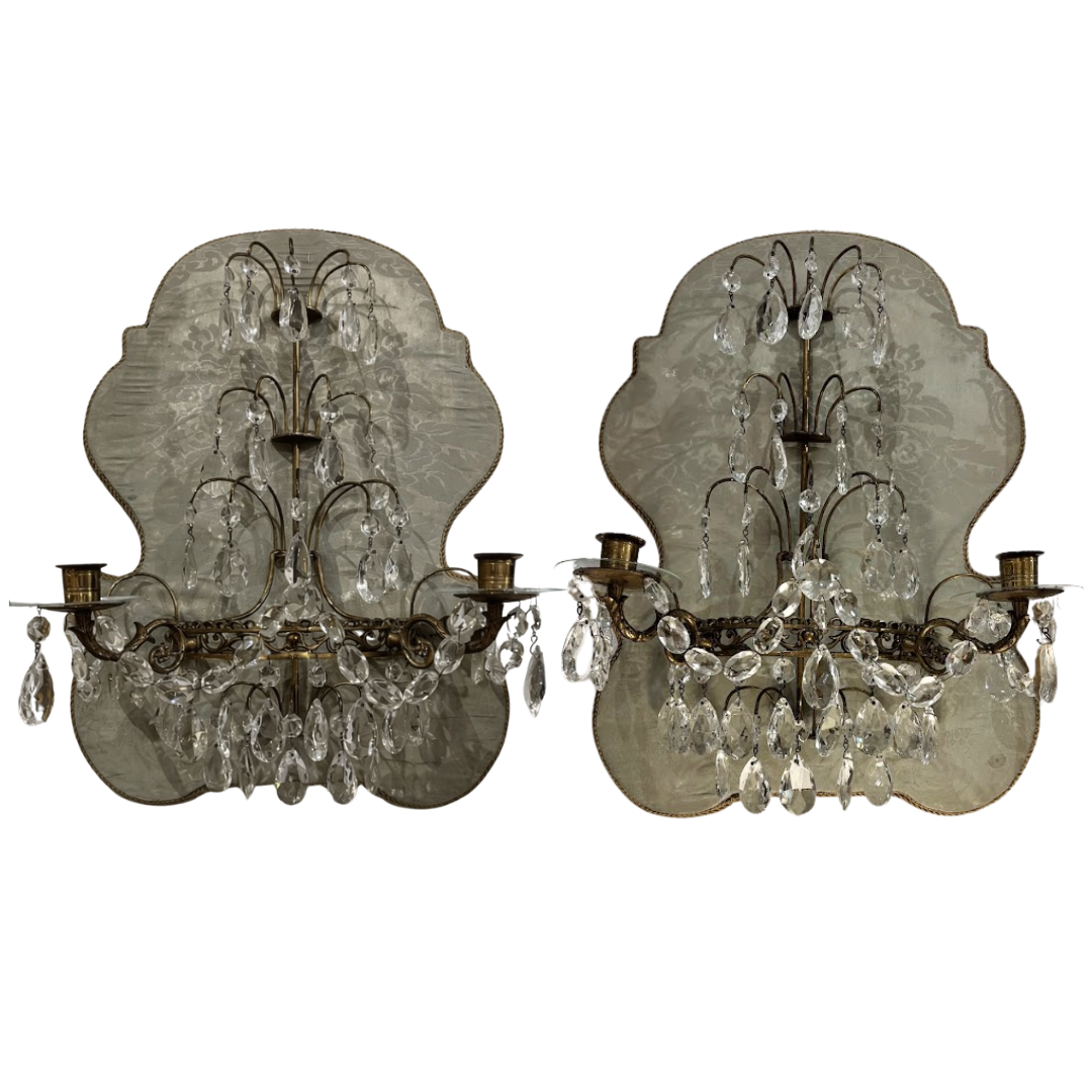 Pair of vintage-style wall sconces with crystal accents on a white background