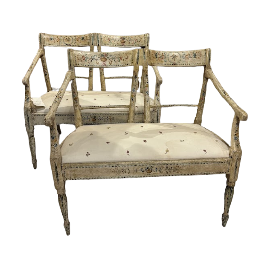 Set of ornate chairs with beige cushions on a white background
