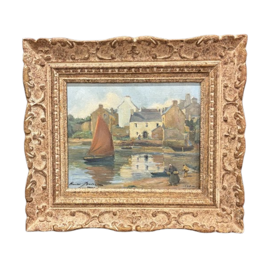 Painting of a village scene with boats in a decorative frame