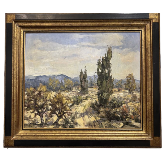 Framed painting of a landscape with trees and mountains