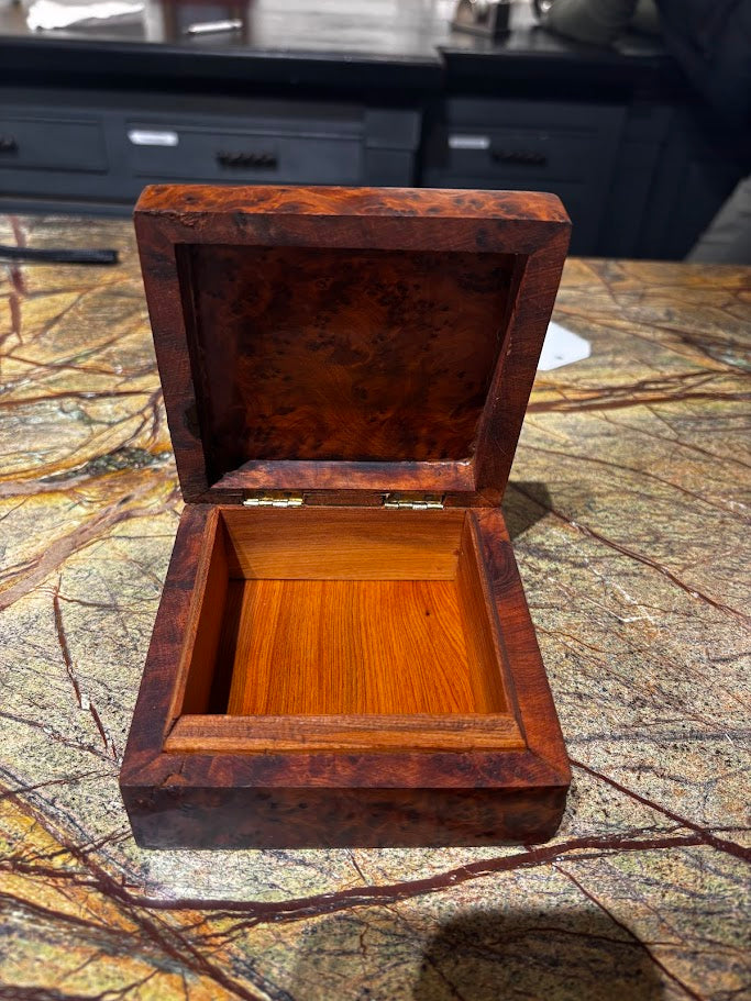 Wooden jewelry box on a marble surface