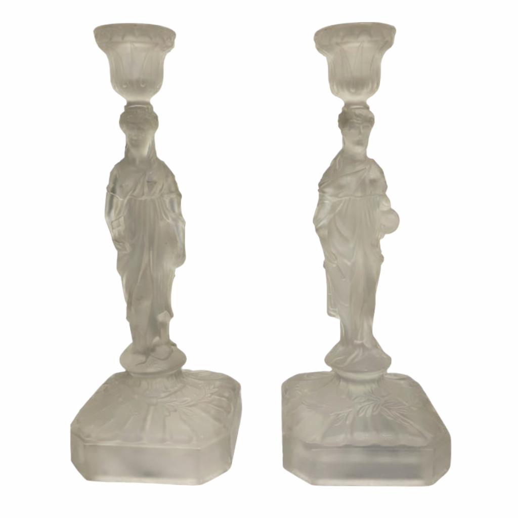 Two frosted glass candle holders with classical figures on a white background